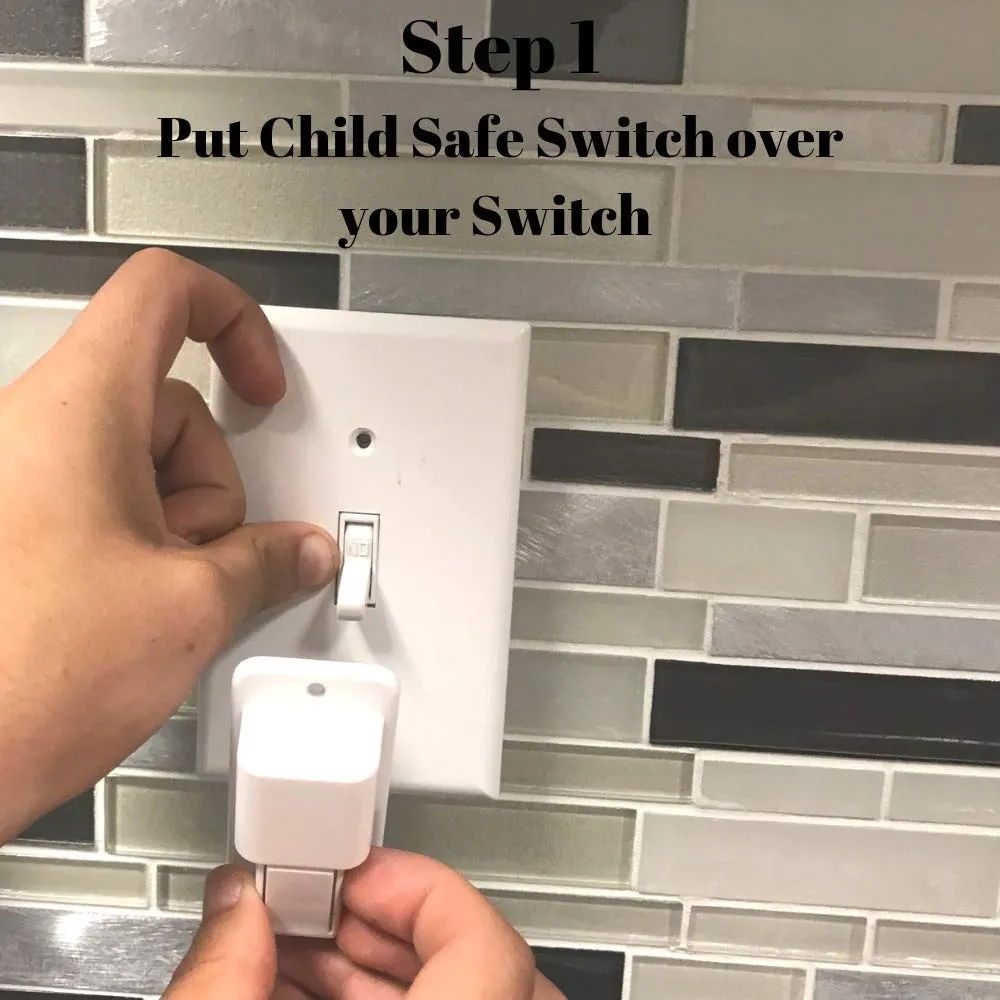 A hand positioning the white cover over an existing toggle switch on a tiled kitchen wall.