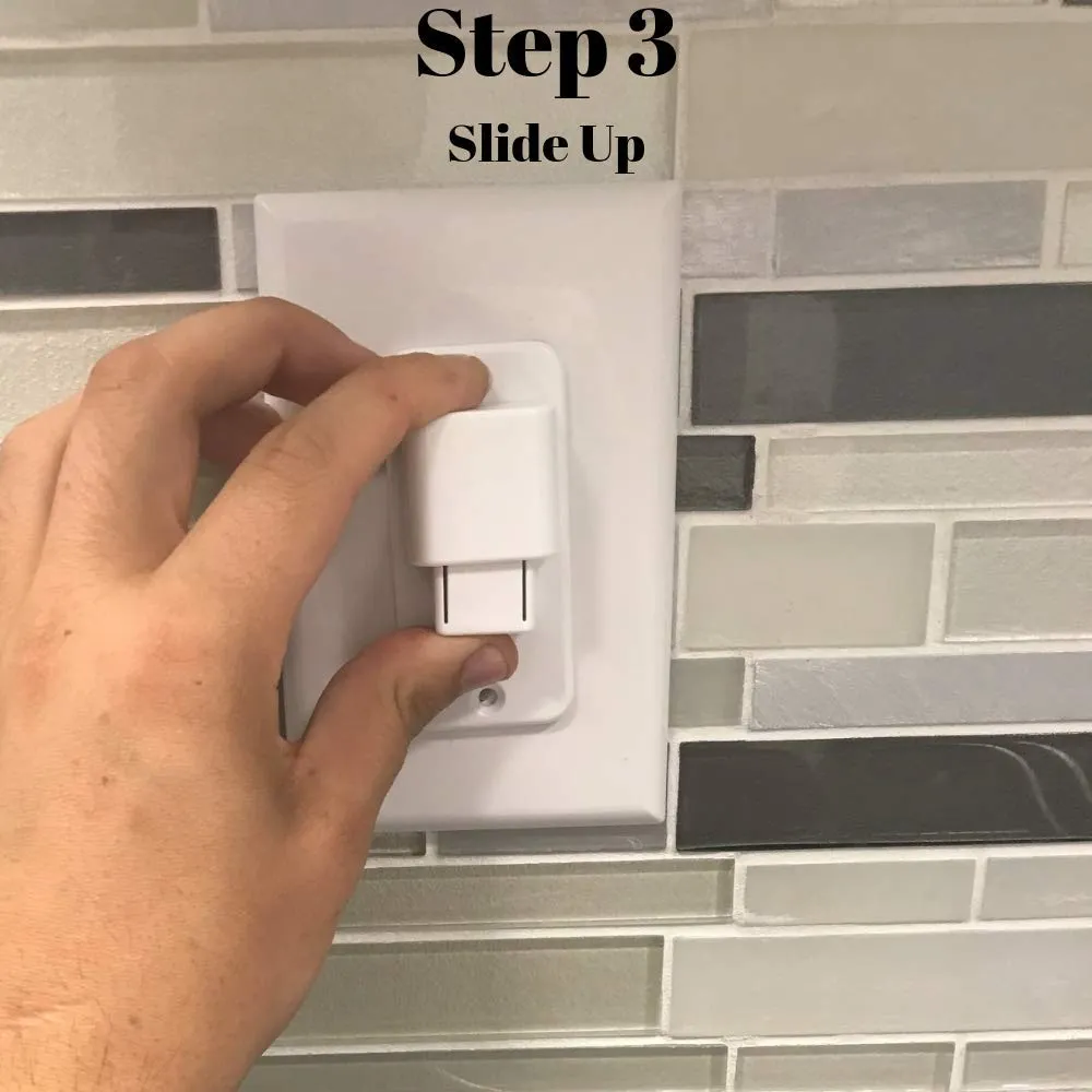 A hand sliding the carriage upward to switch the disposal on.